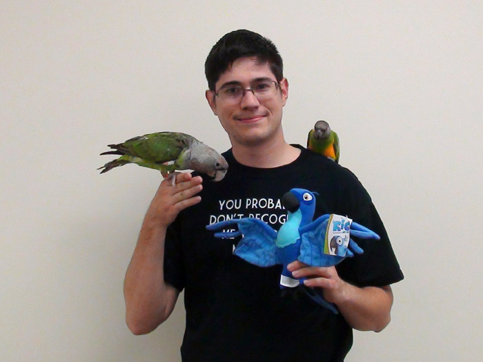 Holding Parrots Blu, Kili, and Truman